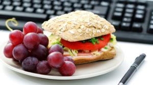 quick lunch in the office - bun and fresh grapes